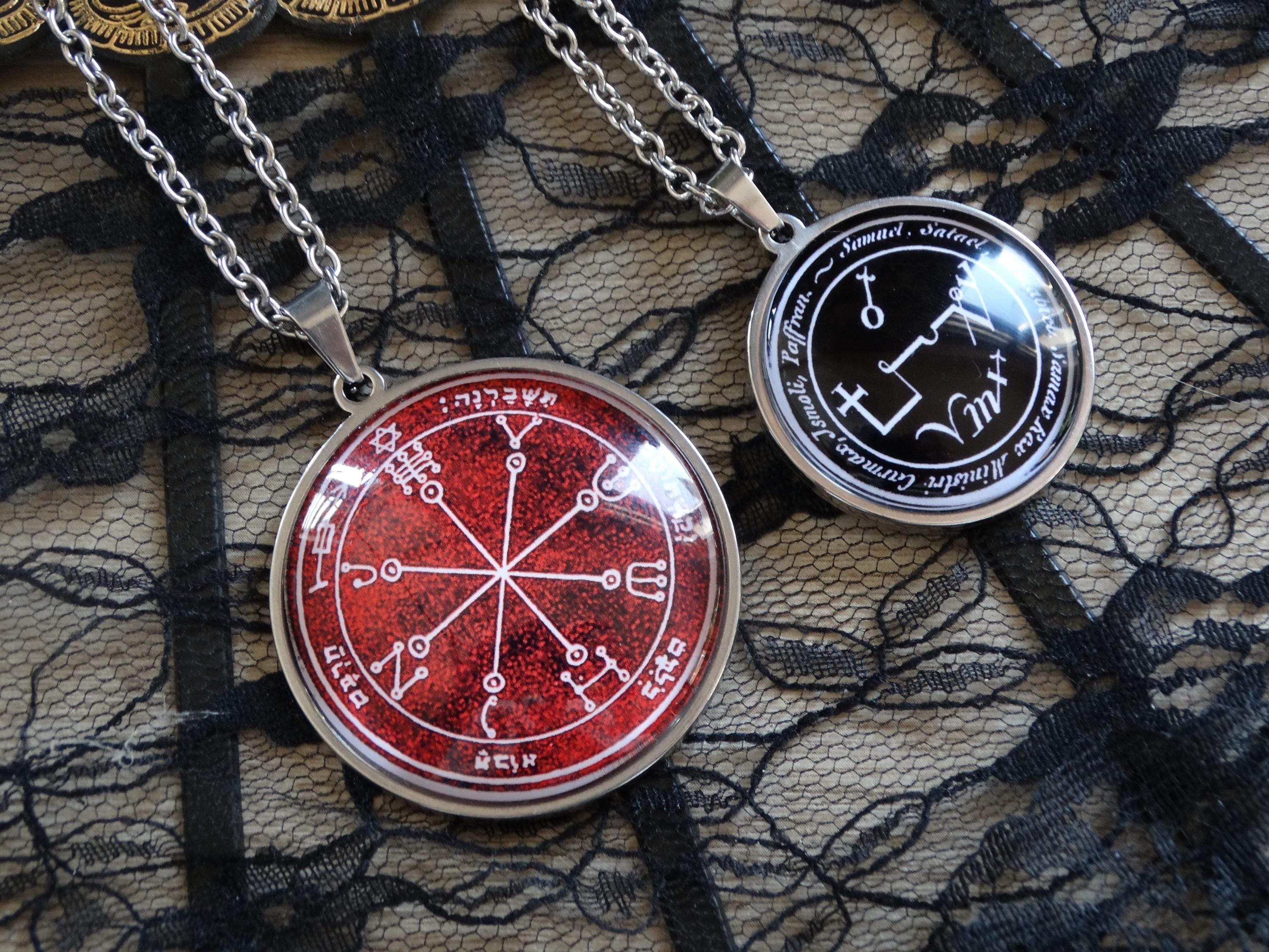 a couple of necklaces sitting on top of a table