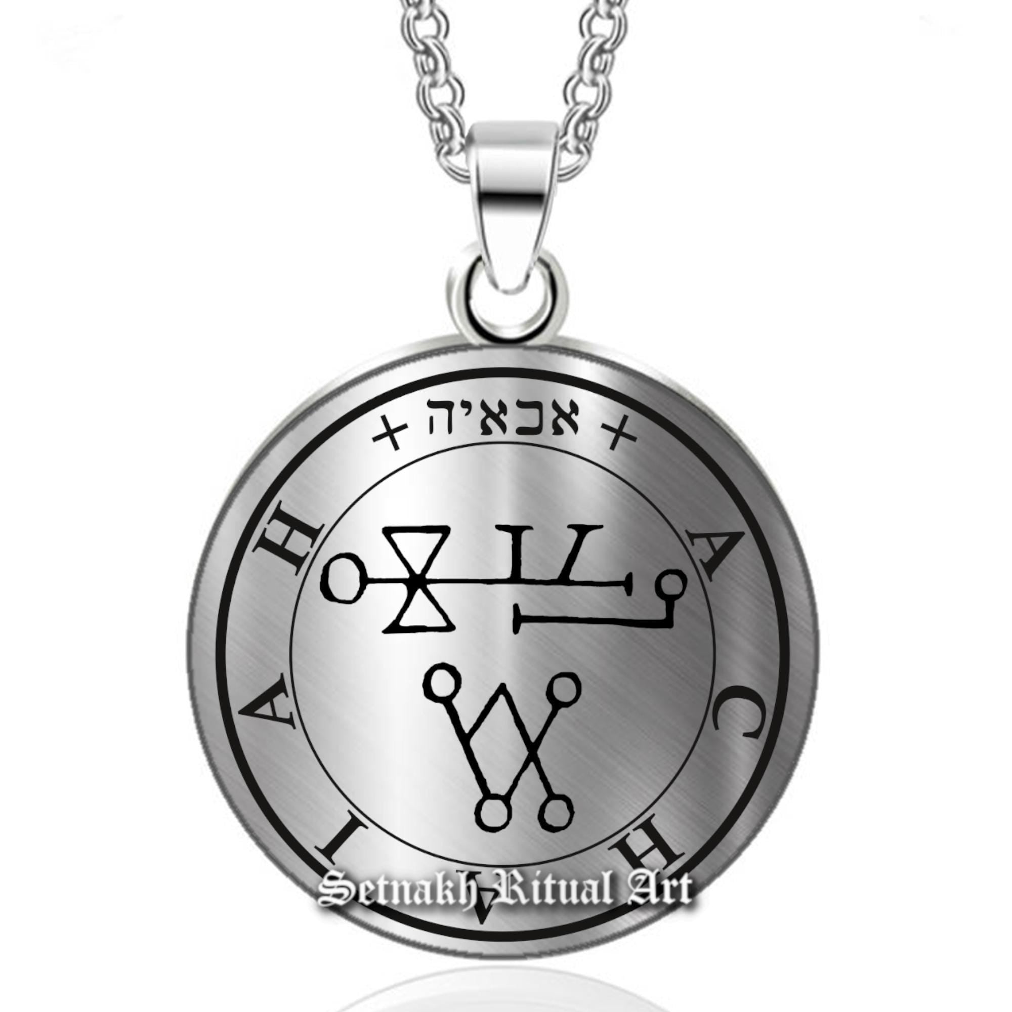 a silver necklace with an image of the zodiac sign