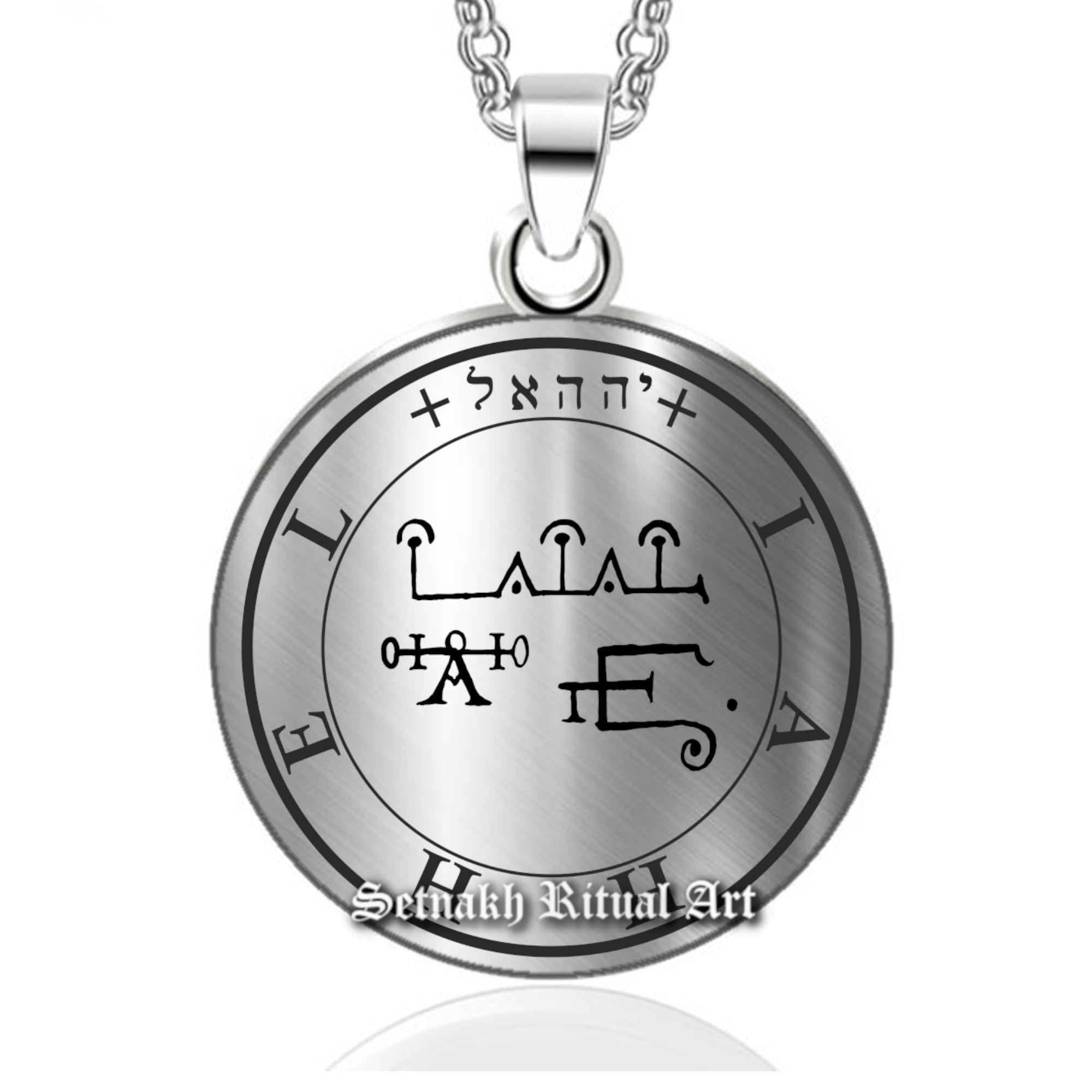 a silver necklace with an egyptian symbol on it